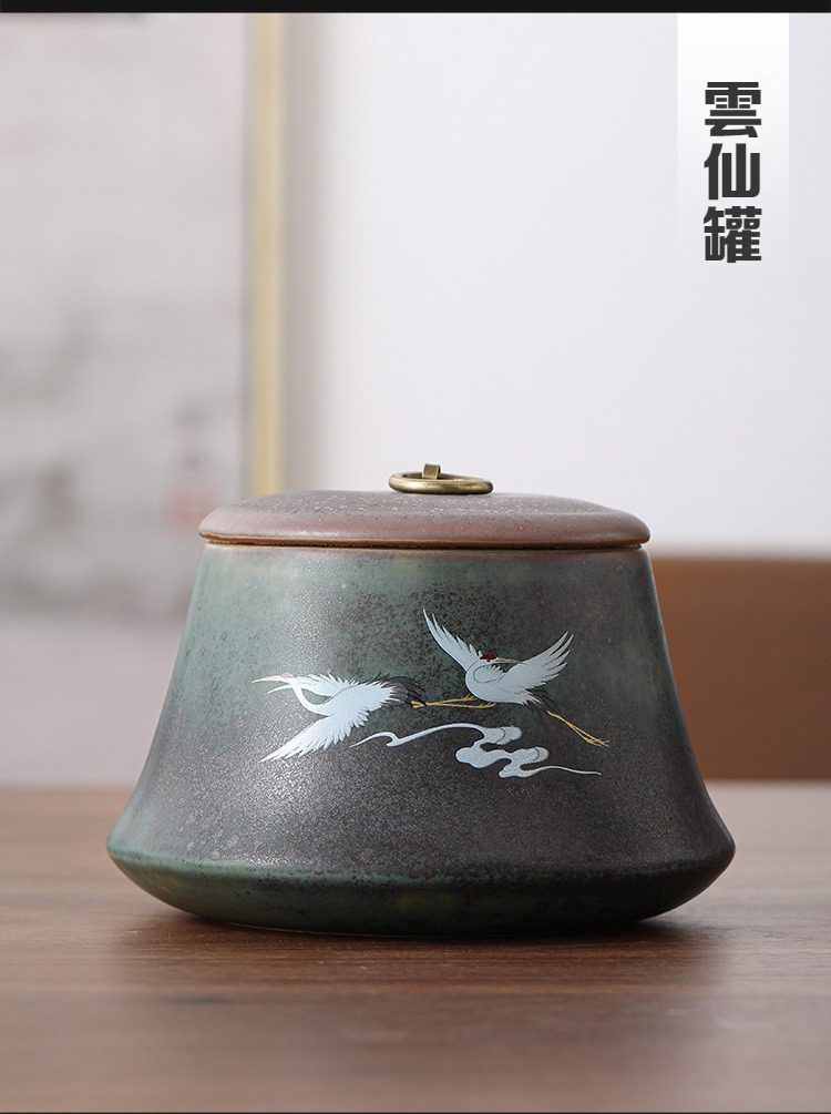 窯變煥彩瑞鶴呈祥茶葉罐，南山居雲仙罐，深綠陶瓷茶葉罐，手繪祥雲雙鶴圖案，古銅提鈕，蘊含東方禪意美學。