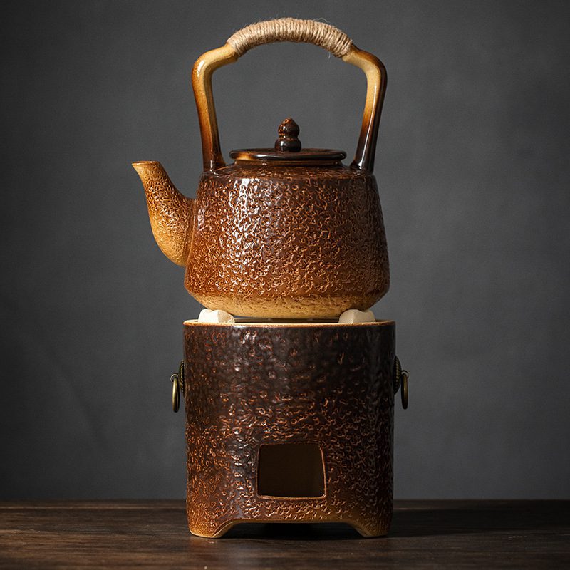 漸變炭火溫茶爐，南山居手工粗陶煮茶器套組，包含柴燒溫茶壺與同色系溫爐。壺身紋理古樸，繩柄設計獨特，展現禪意茶道美學。